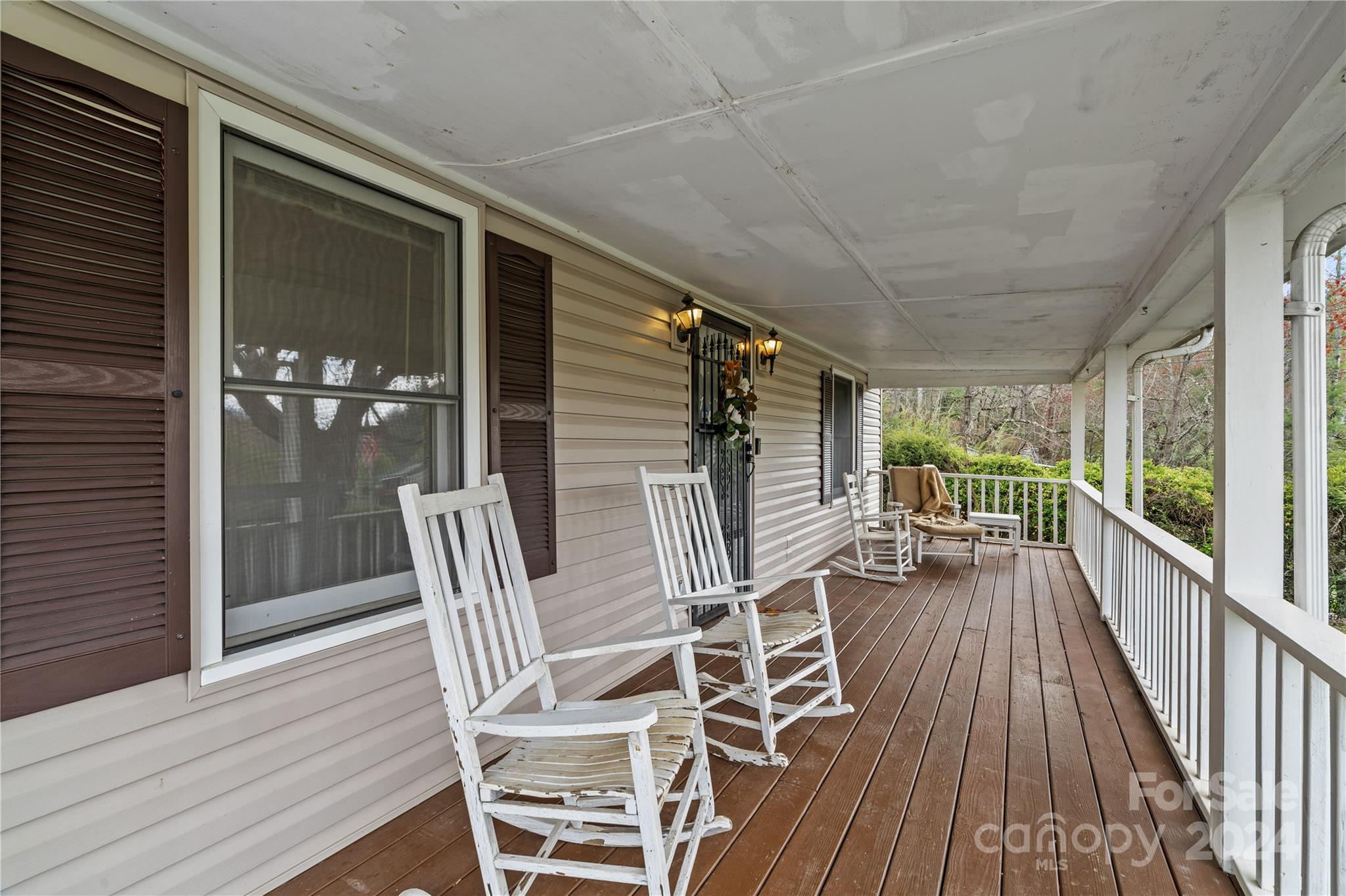 791 Abel Road Canton, NC 28716 - Photo 3 of 36 a view of a balcony with chairs