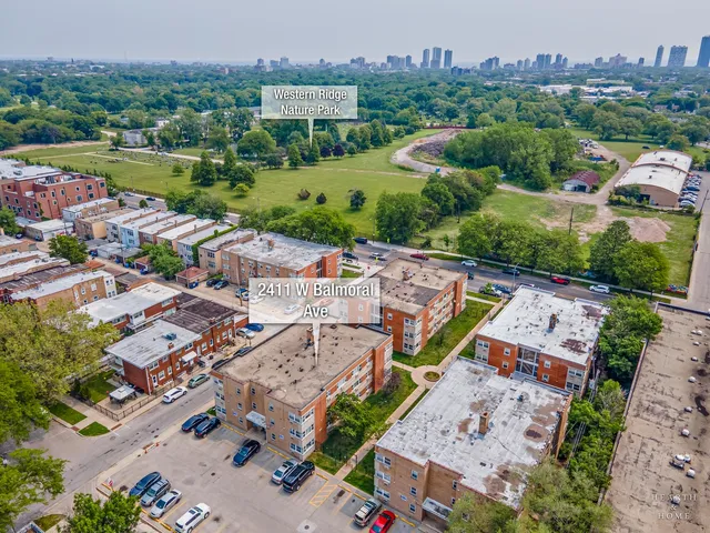 an aerial view of a city with lots of residential buildings