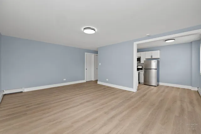 a view of a kitchen with a stove cabinets and wooden floor