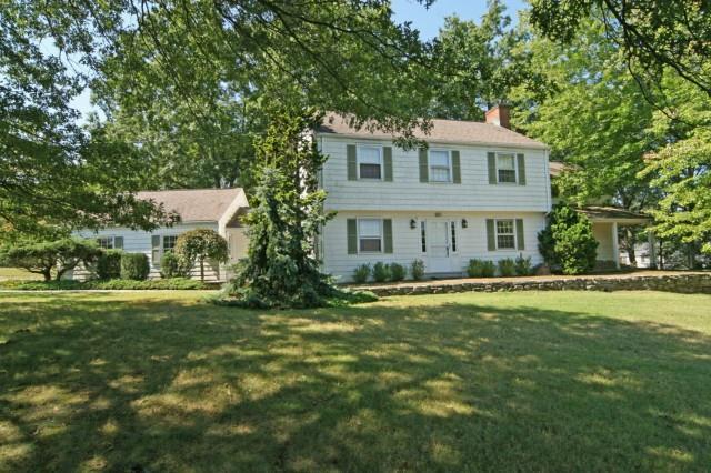 180 Fields Rock Road Fairfield, CT 06890 - Photo 1 of 1 a front view of a house with a yard
