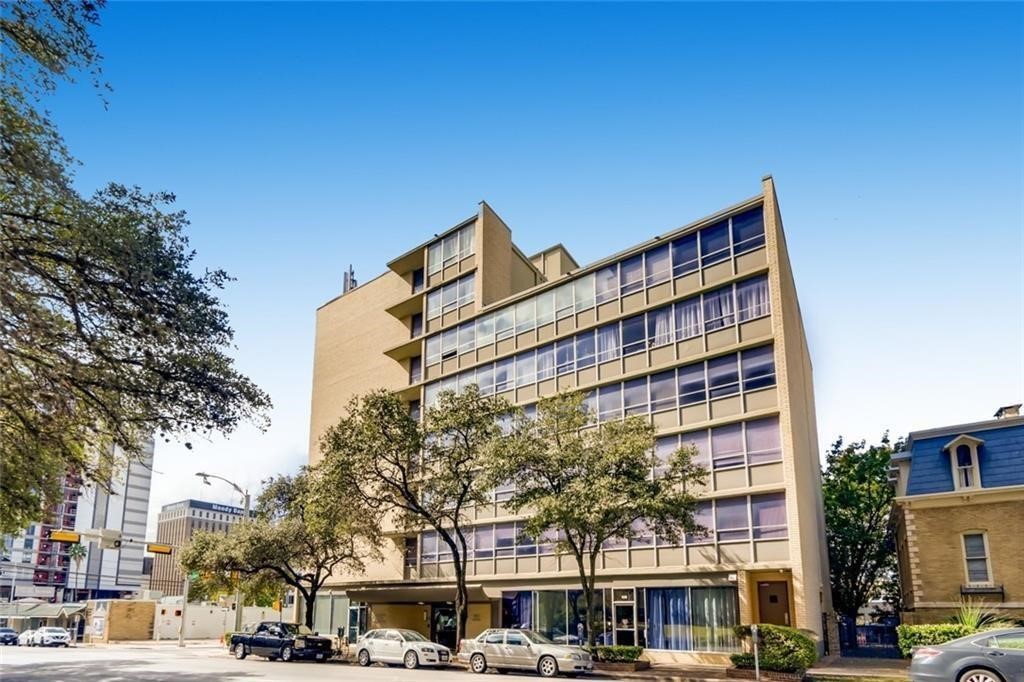 1800 Lavaca Street, Unit 505 Austin, TX 78701 - Photo 1 of 9 a front view of a building with lot of cars and trees