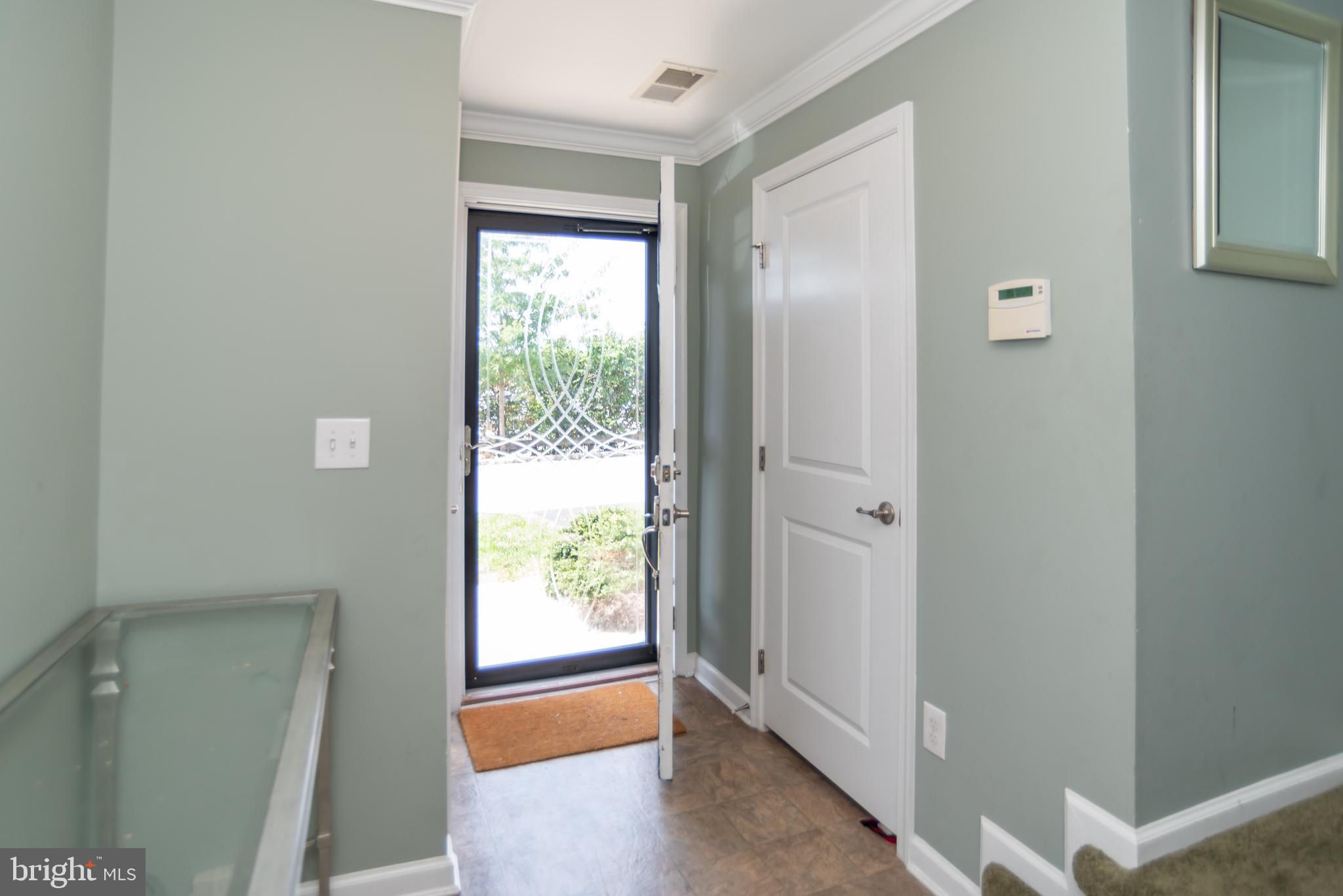 145 Old Cedarbrook Road, Unit 26 Wyncote, PA 19095 - Photo 4 of 34 Foyer entrance- ample storage. Garage access.