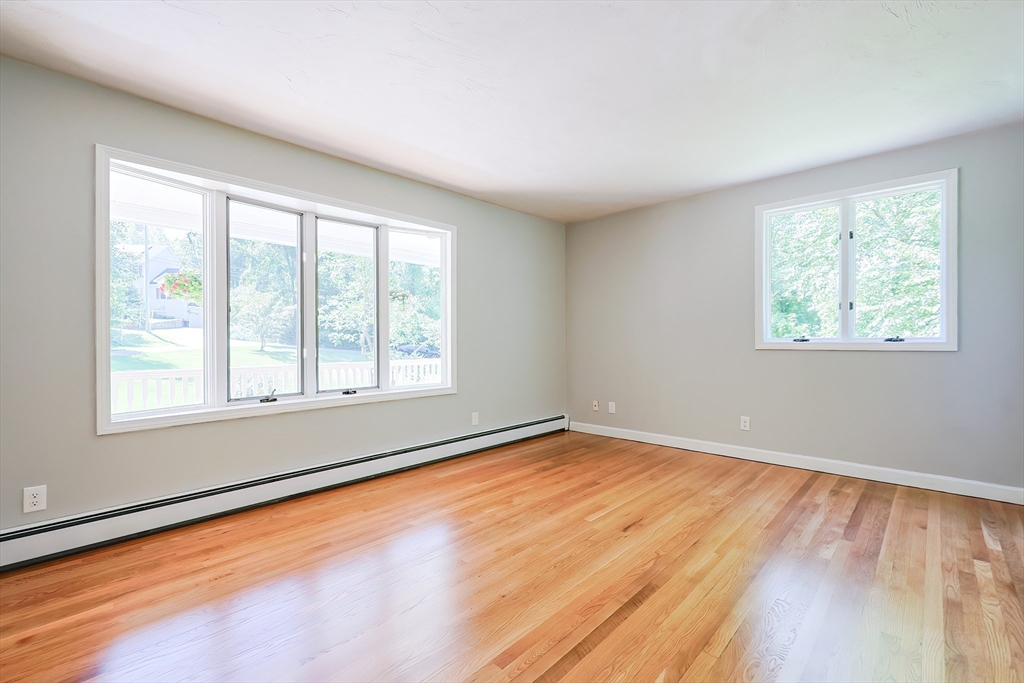 10 Prospect Street Upton, MA 01568 - Photo 11 of 41 a view of an empty room with wooden floor and a window