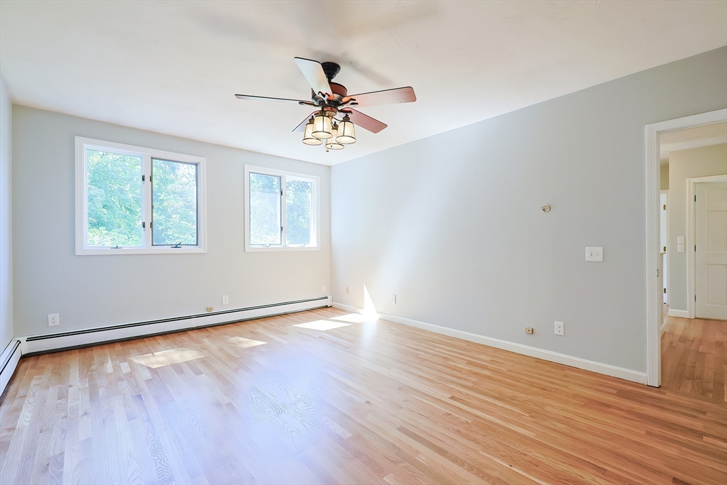 10 Prospect Street Upton, MA 01568 - Photo 18 of 41 a view of an empty room with wooden floor and a window