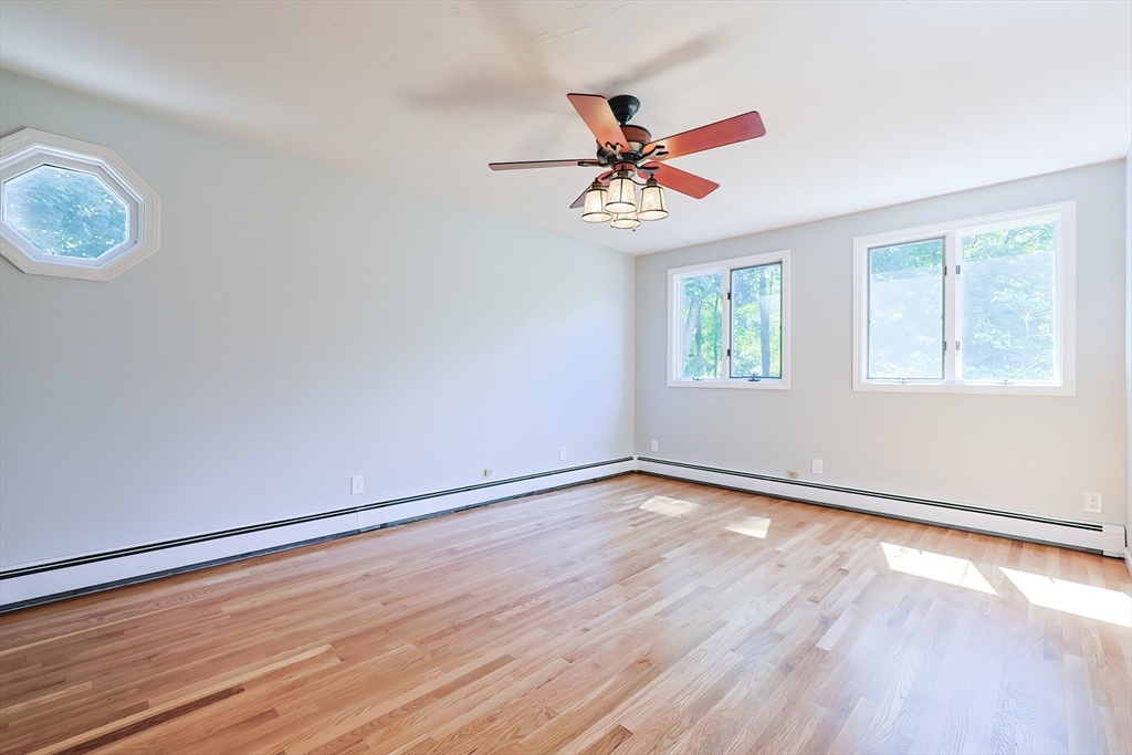 10 Prospect Street Upton, MA 01568 - Photo 19 of 41 a view of an empty room with wooden floor and a window
