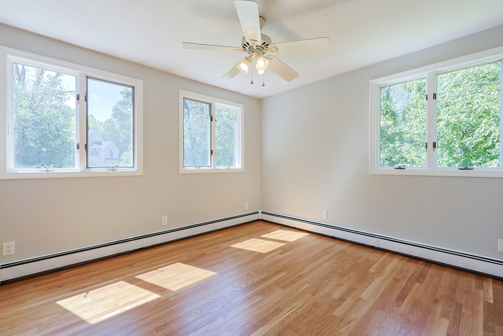 10 Prospect Street Upton, MA 01568 - Photo 29 of 41 a view of an empty room with wooden floor and a window