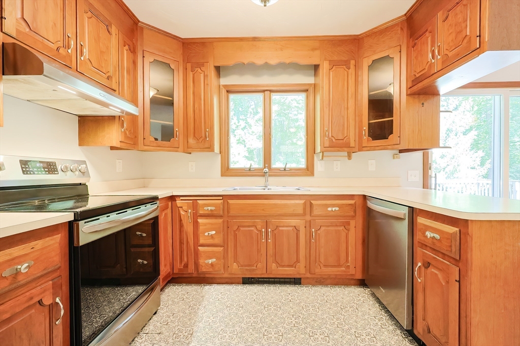 10 Prospect Street Upton, MA 01568 - Photo 5 of 41 a kitchen with stainless steel appliances granite countertop wooden cabinets a sink and dishwasher