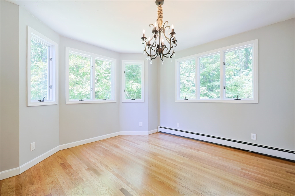 10 Prospect Street Upton, MA 01568 - Photo 8 of 41 a view of a big room with windows and chandelier