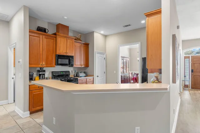 a room with a television and appliances