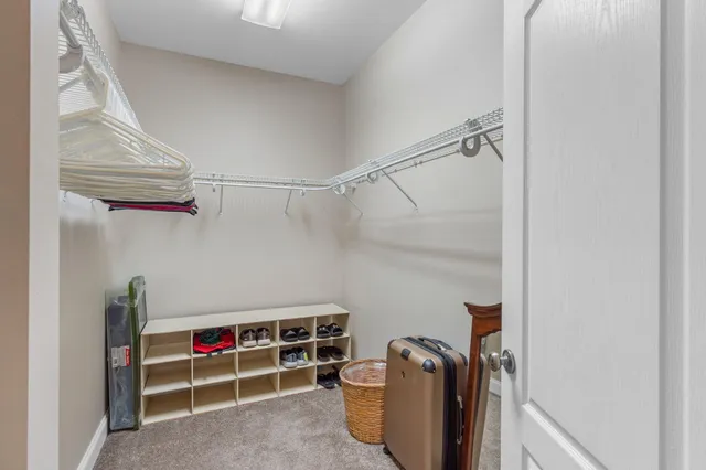 a view of storage and utility room with racks on the wall