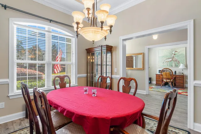 a view of a dining room with furniture and window