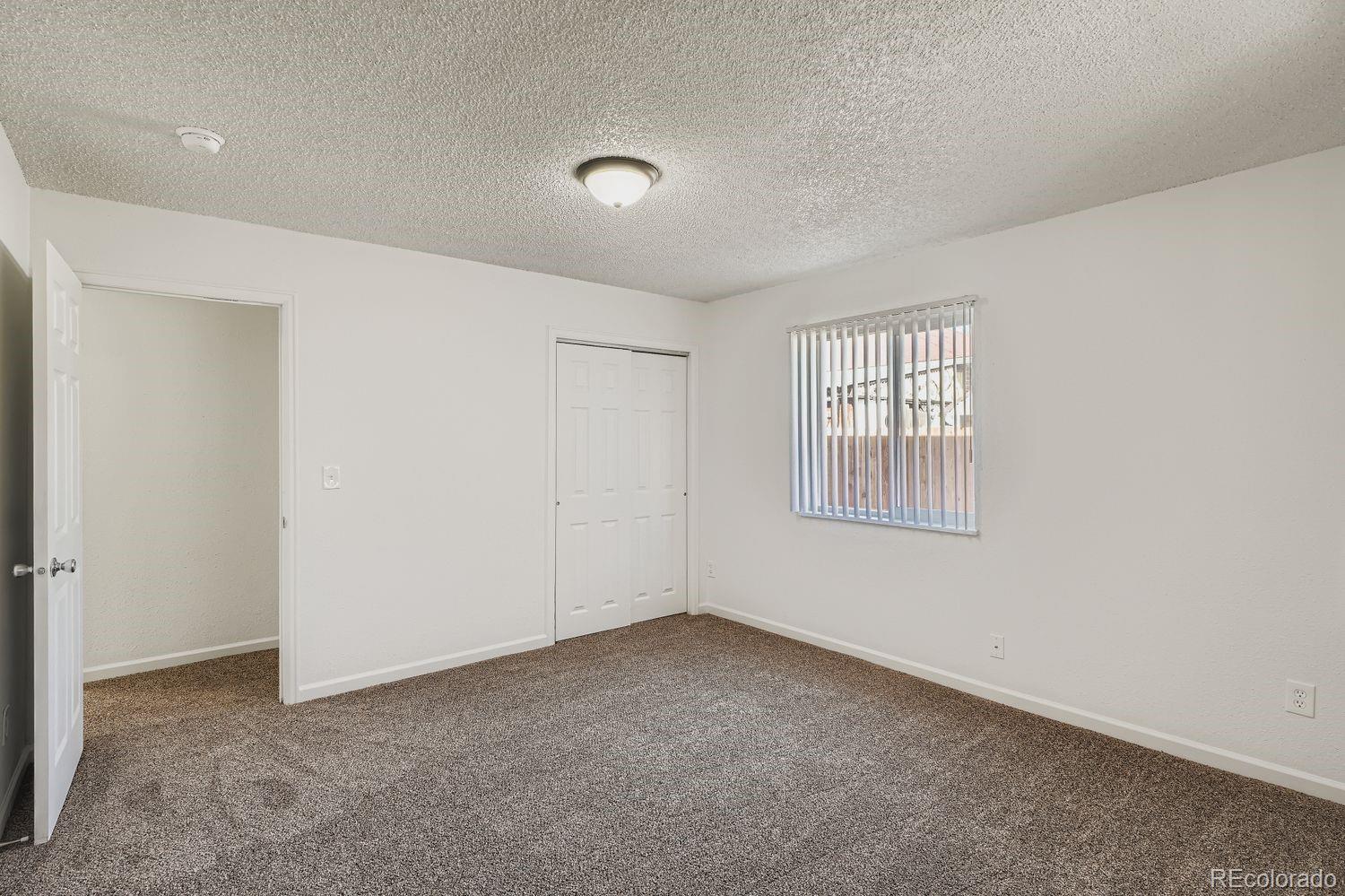 3670 Magnolia Street Denver, CO 80207 - Photo 14 of 26 an empty room with windows