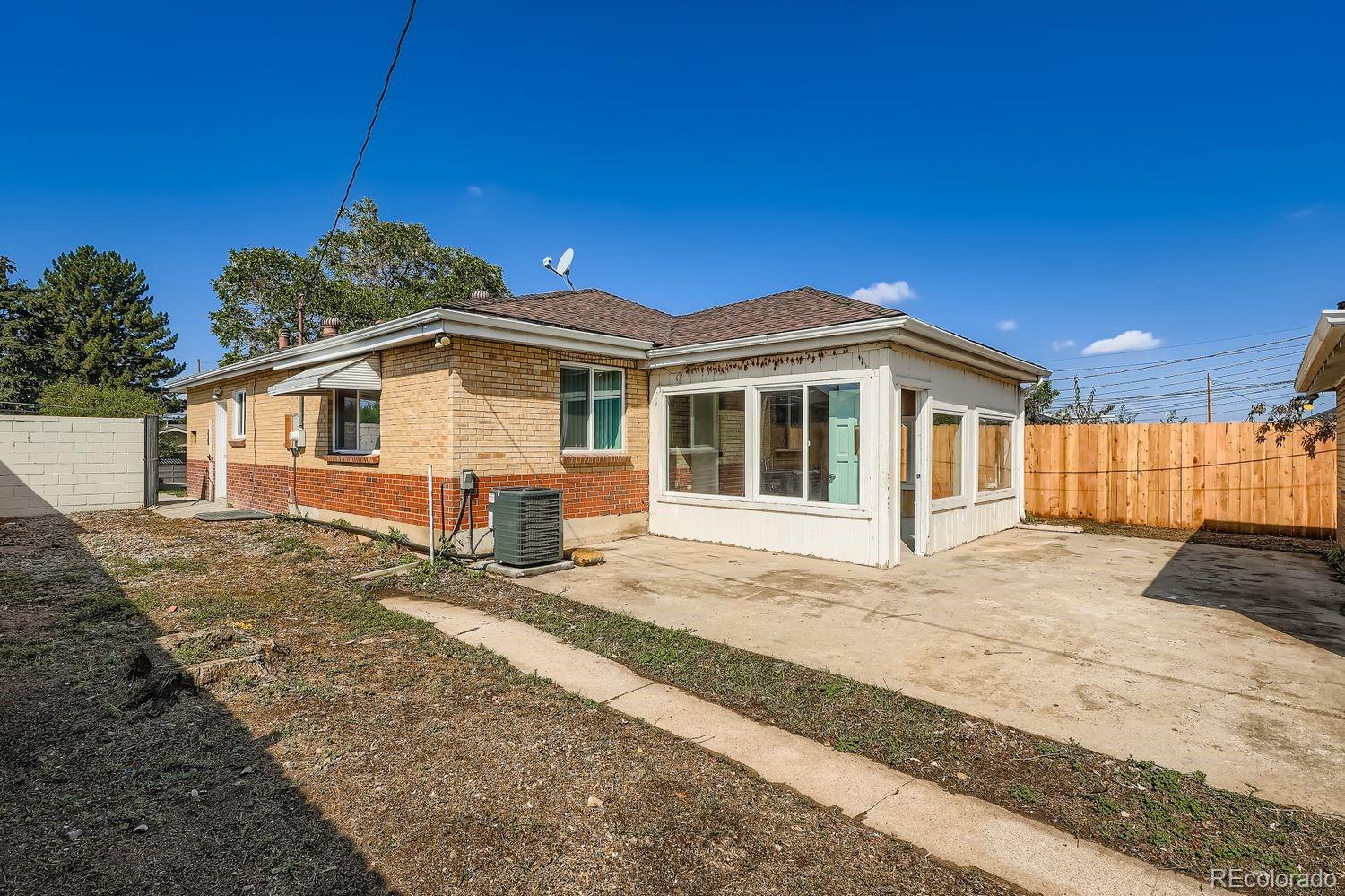 3670 Magnolia Street Denver, CO 80207 - Photo 21 of 26 a view of a house with a patio