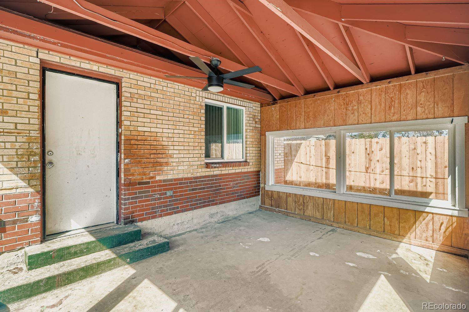 3670 Magnolia Street Denver, CO 80207 - Photo 22 of 26 a view of an empty room with a window