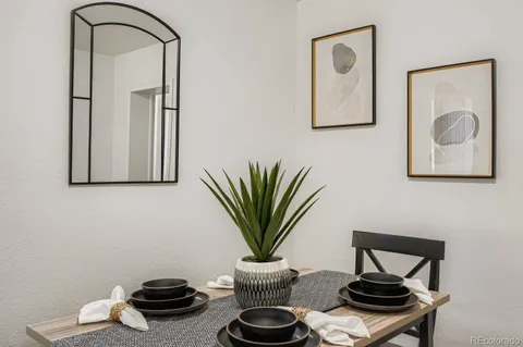 a view of a room with furniture and a potted plant