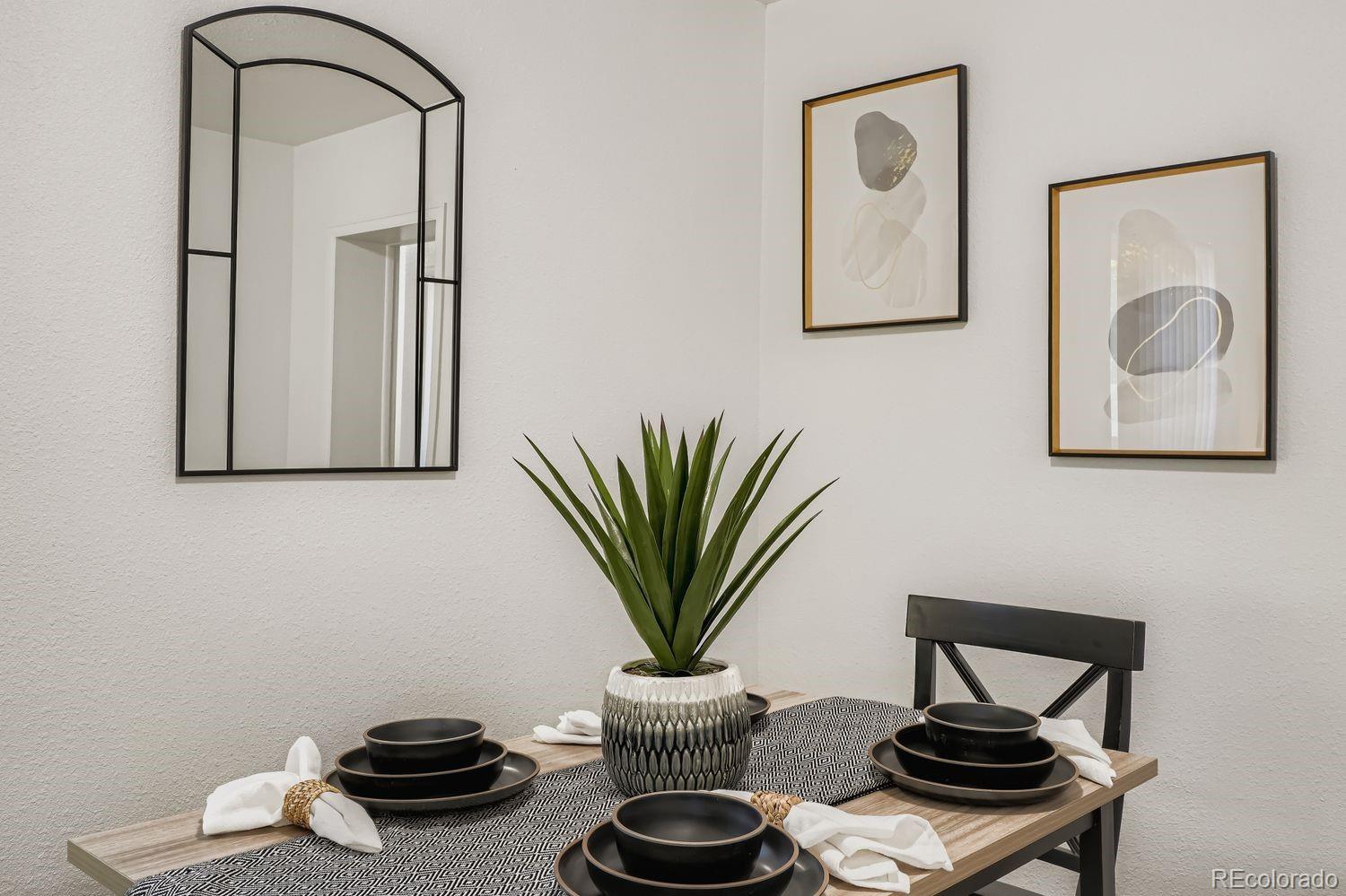 3670 Magnolia Street Denver, CO 80207 - Photo 24 of 26 a view of a room with furniture and a potted plant