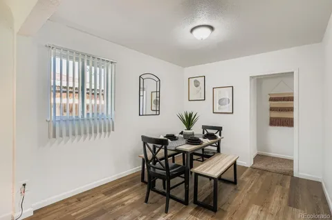 a dining room with furniture and window