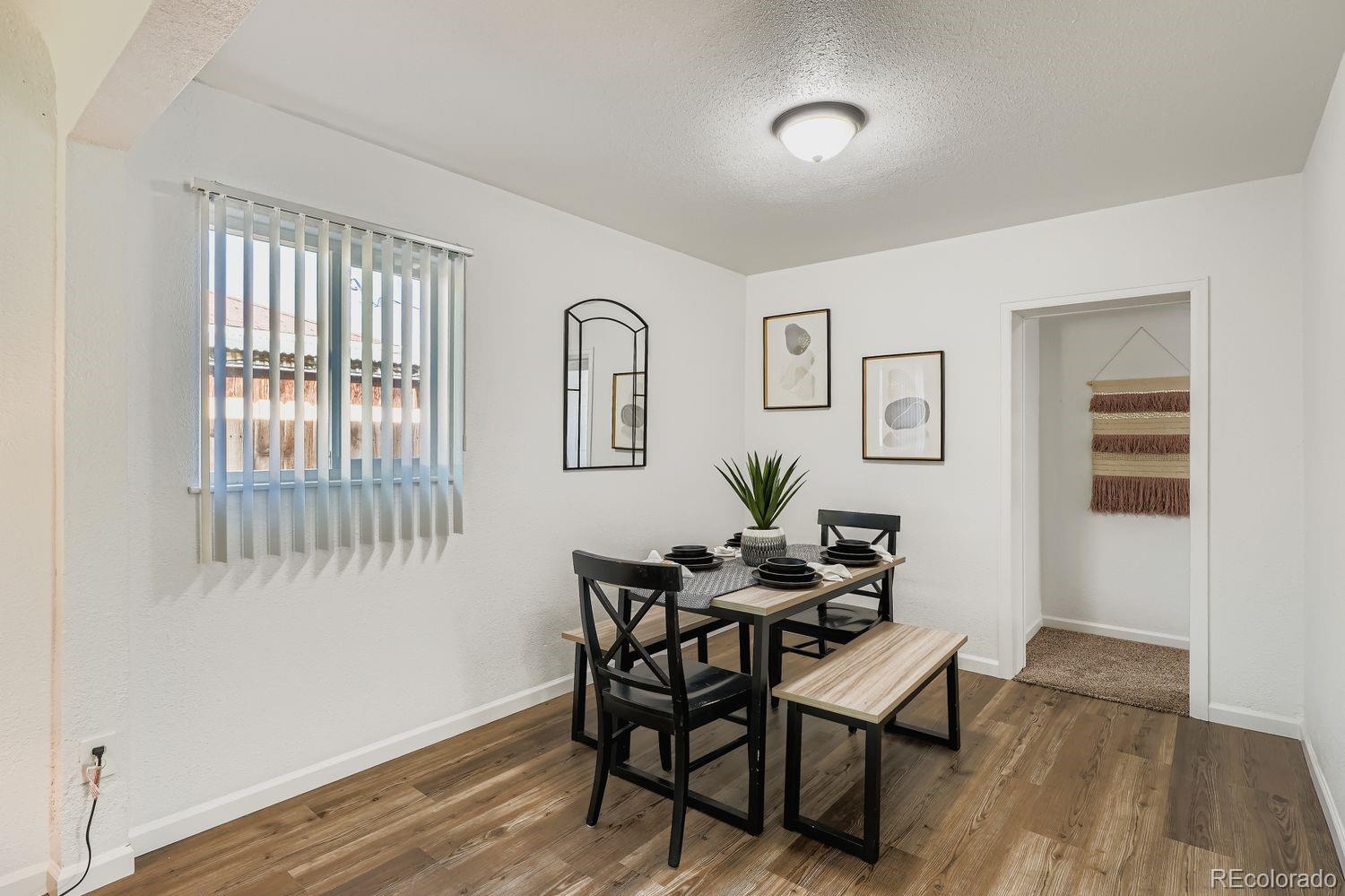3670 Magnolia Street Denver, CO 80207 - Photo 8 of 26 a dining room with furniture and window