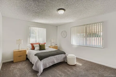 a bedroom with bed and window