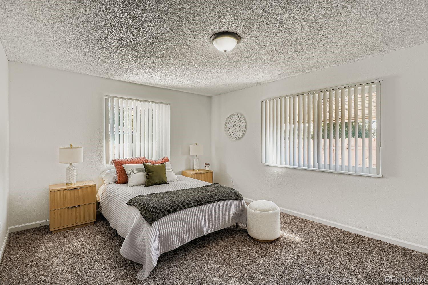 3670 Magnolia Street Denver, CO 80207 - Photo 9 of 26 a bedroom with bed and window