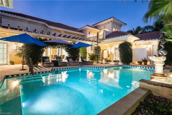 a view of a swimming pool with a patio