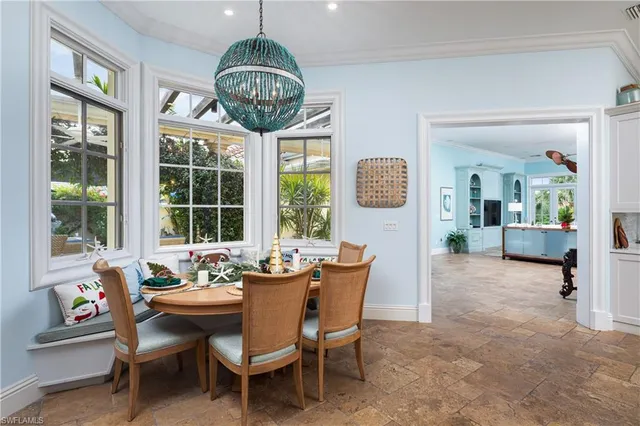 a dining room with furniture a livingroom and chandelier