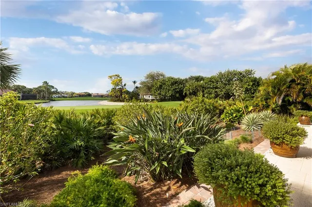 a view of a lake with a house in the background