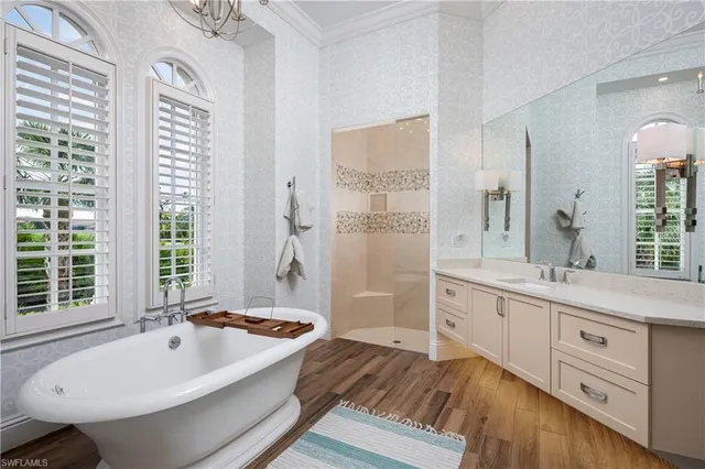 a view of a house with backyard sitting area and garden