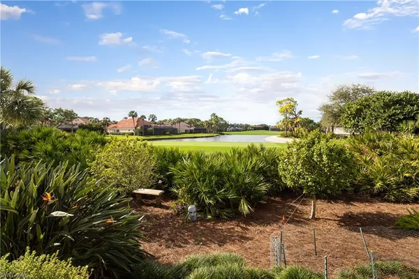 a bedroom with a bed couch and window