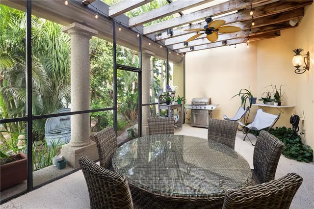 a front view of a house with swimming pool and porch