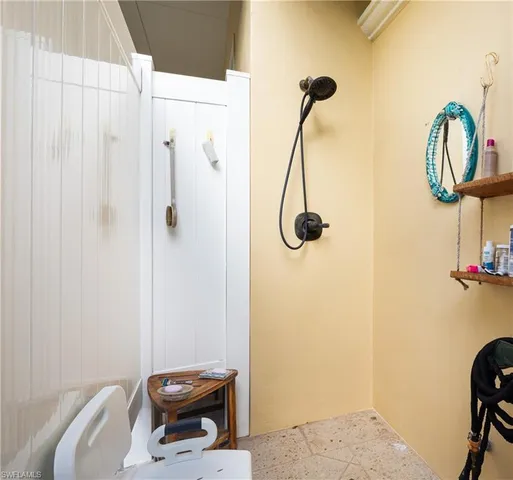 a aerial view of a house with outdoor space and a lake view