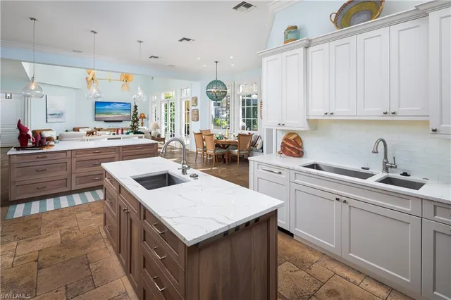 a kitchen with a sink stove and cabinets