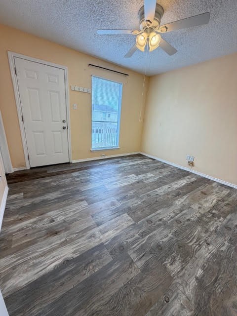 6702 Everhart Road, Unit A107 Corpus Christi, TX 78413 - Photo 6 of 13 a view of an empty room with window and wooden floor