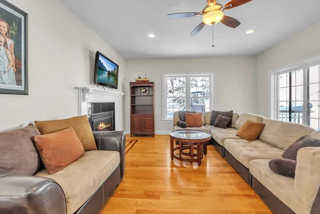 a living room with furniture and a fireplace