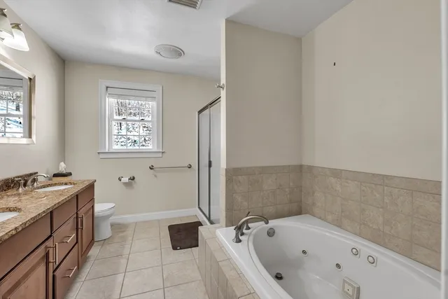 a bathroom with a bathtub sink and toilet