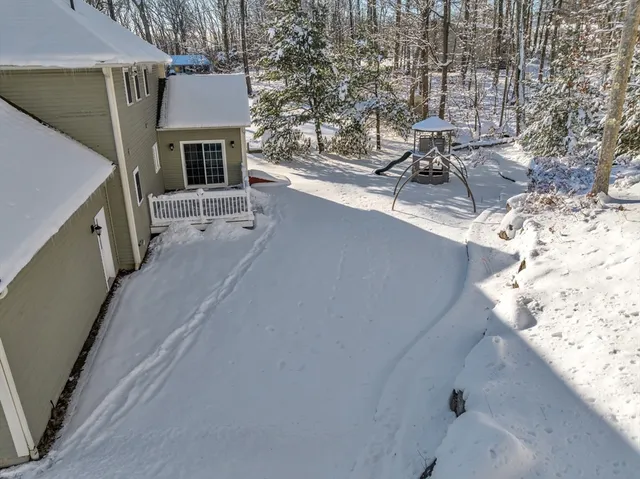 a view of roof deck with patio