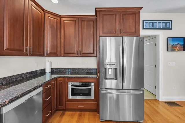 a kitchen with appliances and cabinets
