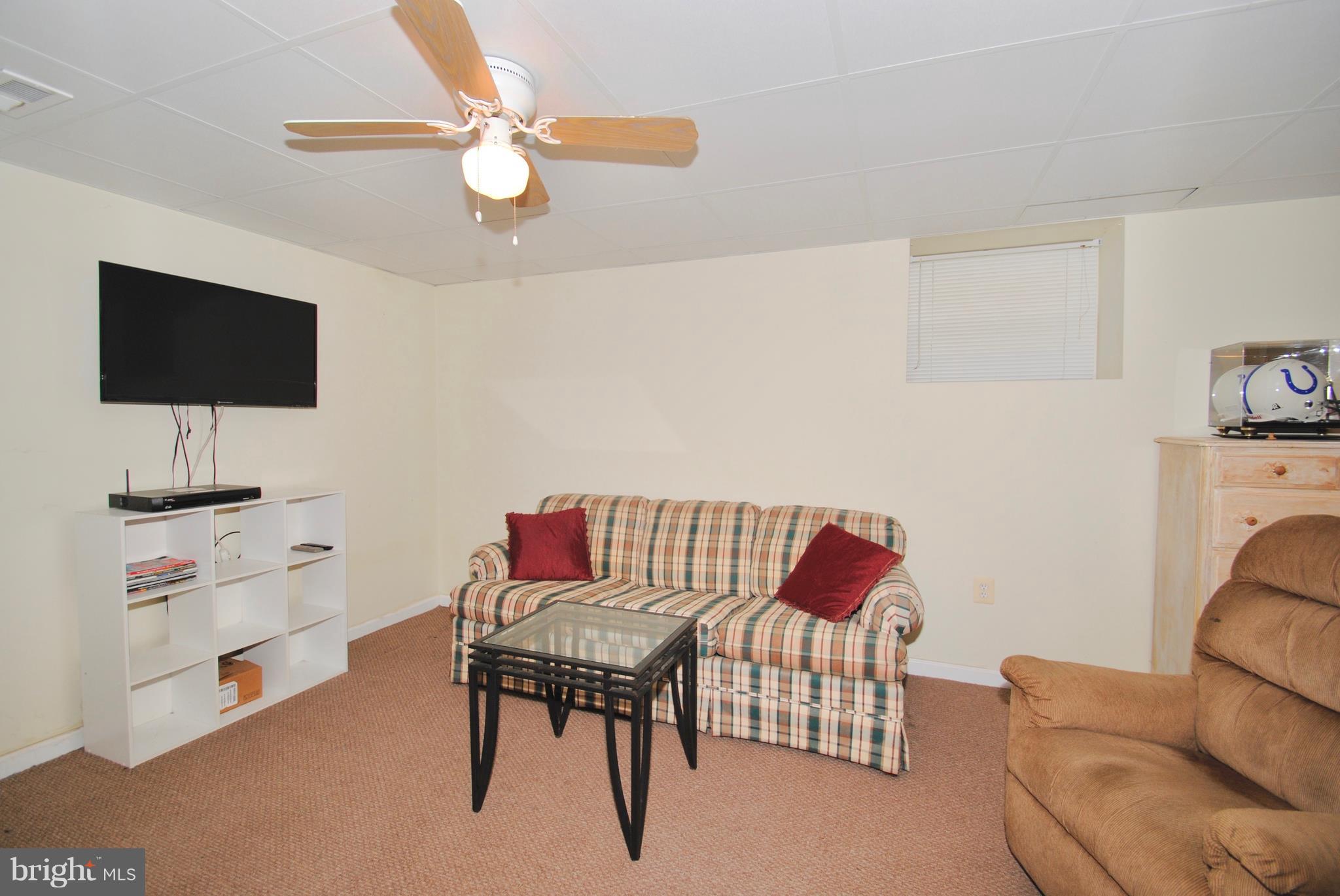 302 Fairhaven Road Tracys Landing, MD 20779 - Photo 18 of 24 a living room with furniture and a flat screen tv