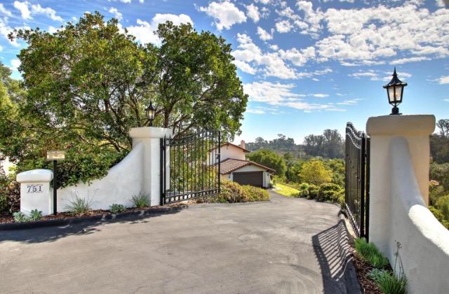 a view of a street with a tree in the background