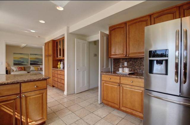751 Skyview Drive Santa Barbara, CA 93108 - Photo 13 of 31 a kitchen with stainless steel appliances granite countertop a refrigerator and a stove top oven