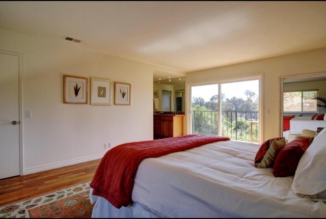 751 Skyview Drive Santa Barbara, CA 93108 - Photo 16 of 31 a bedroom with a large bed and a large window