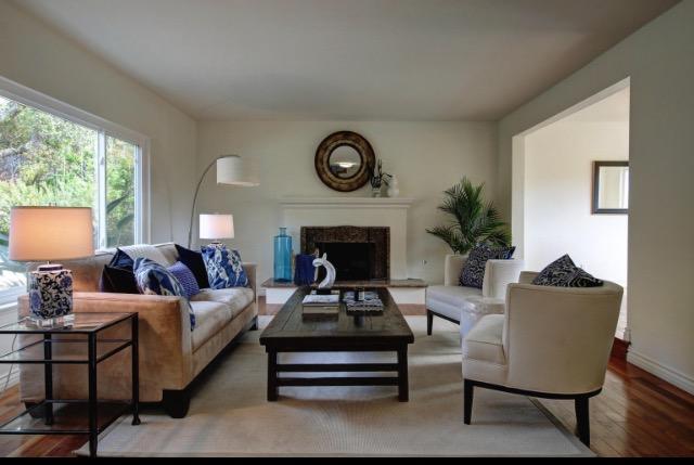 751 Skyview Drive Santa Barbara, CA 93108 - Photo 2 of 31 a living room with furniture a window and a fireplace