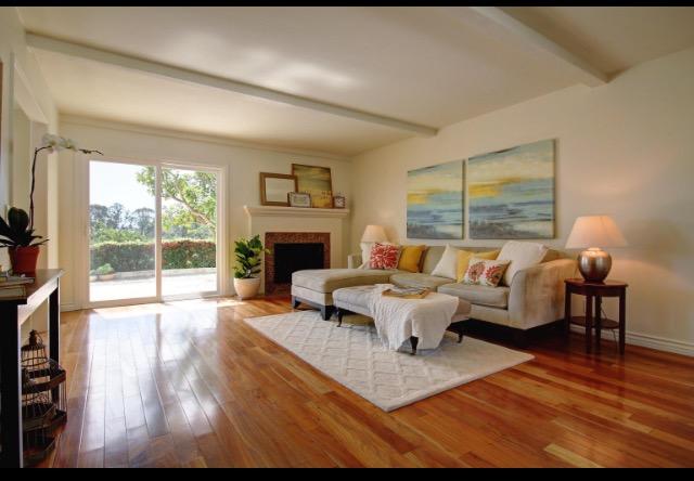 751 Skyview Drive Santa Barbara, CA 93108 - Photo 4 of 31 a living room with furniture large window and a fireplace