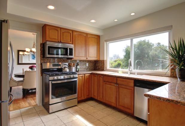 751 Skyview Drive Santa Barbara, CA 93108 - Photo 7 of 31 a kitchen with stainless steel appliances granite countertop a stove a sink and a microwave