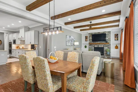 a kitchen with stainless steel appliances a stove a sink and cabinets