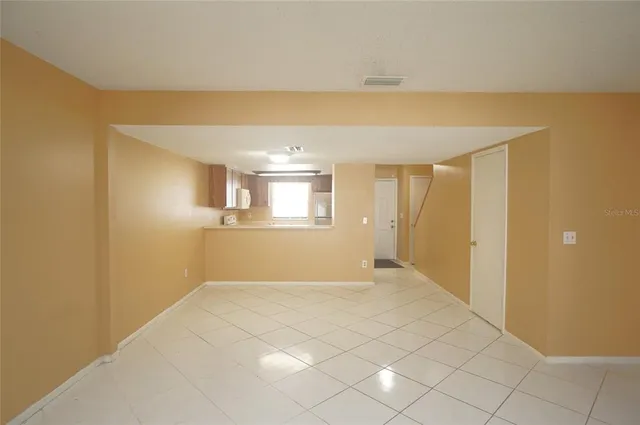 a view of an empty room and window