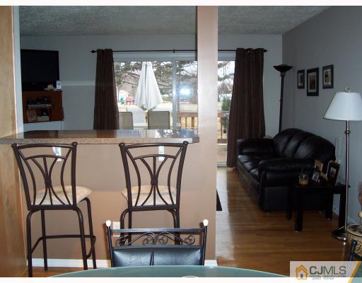 55 Princeton Road Old Bridge, NJ 08859 - Photo 4 of 7 a table chair sitting in a kitchen next to a window