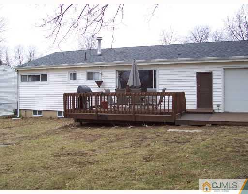 55 Princeton Road Old Bridge, NJ 08859 - Photo 7 of 7 a view of a house with wooden deck and furniture