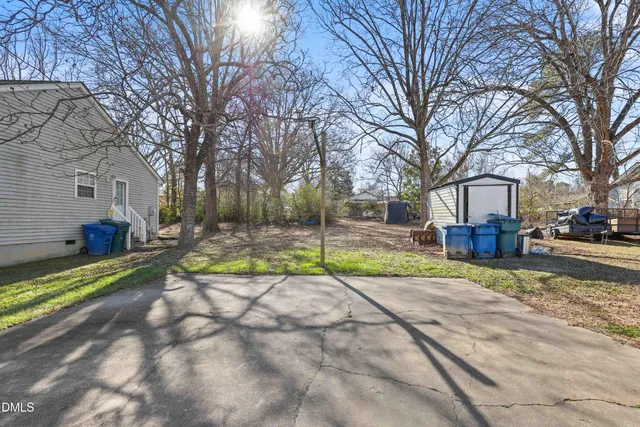 a view of a park with large trees
