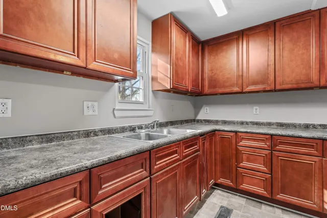 a kitchen with granite countertop cabinets stainless steel appliances granite counter tops and a wooden cabinets